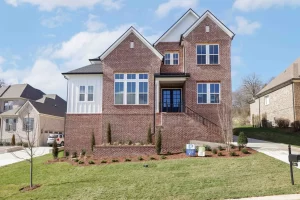 Stunning move-in-ready newly constructed home in the highly sought after Hart's Landmark community located a short distance from historic downtown Franklin. This home features 4 spacious bedrooms and 4 and a half beautifully designed bathrooms. Primary bedroom on the first level features soaring vaulted ceilings, an abundance of natural light, and leads to the polished en-suite with double vanities, spa-like shower and tub, and a substantial walk-in-closet. French doors leading into the study provide privacy while the unique accent wall elevates the space. Gourmet kitchen features custom cabinetry, an oversized island, upgraded appliances and leads to a large pantry. Just outside of the bright and airy living room is a covered back porch, perfect for easy living and entertaining.